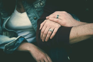 married couple holding hands