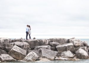 couple literally on the rocks but they are hugging