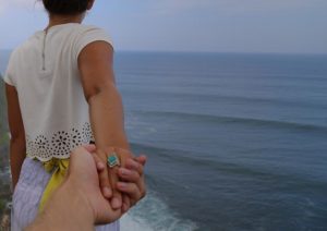 woman leading man by the hand