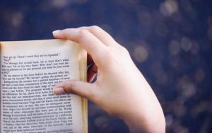 woman holding book