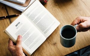 man reading, with coffee